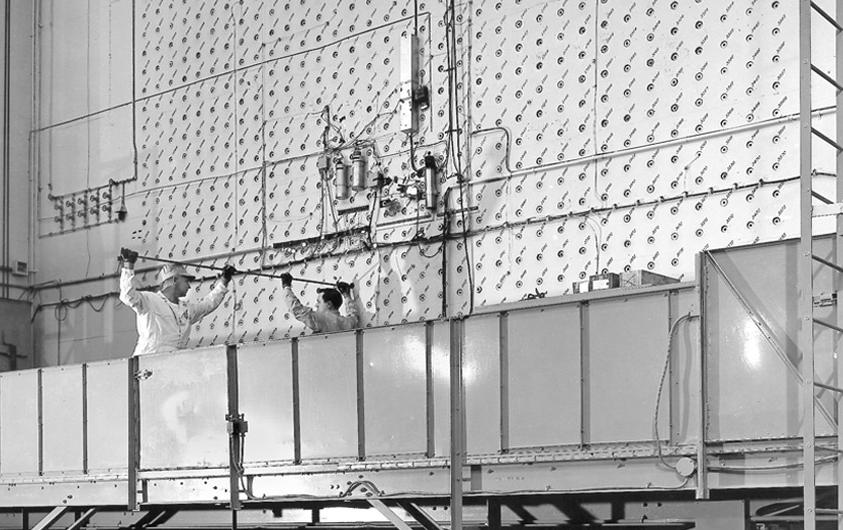 Workers load uranium slugs into the X-10 Graphite Reactor at Oak Ridge in 1943