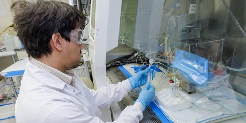 Student working in the Texas A&M University lab processing astatine-211. Image courtesy of Texas A&M University.