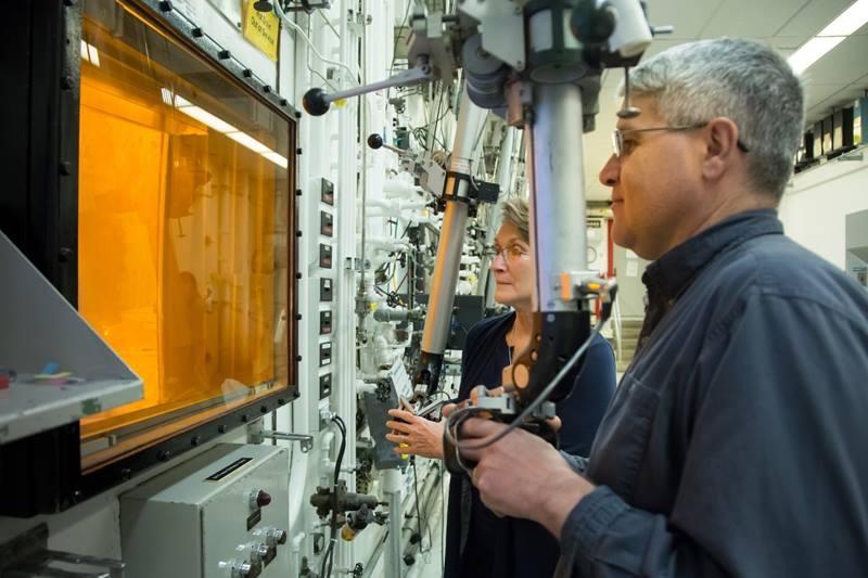 Radiochemical technicians David Denton and Karen Murphy use hot cell manipulators at Oak Ridge National Laboratory during the production of actinium-227.