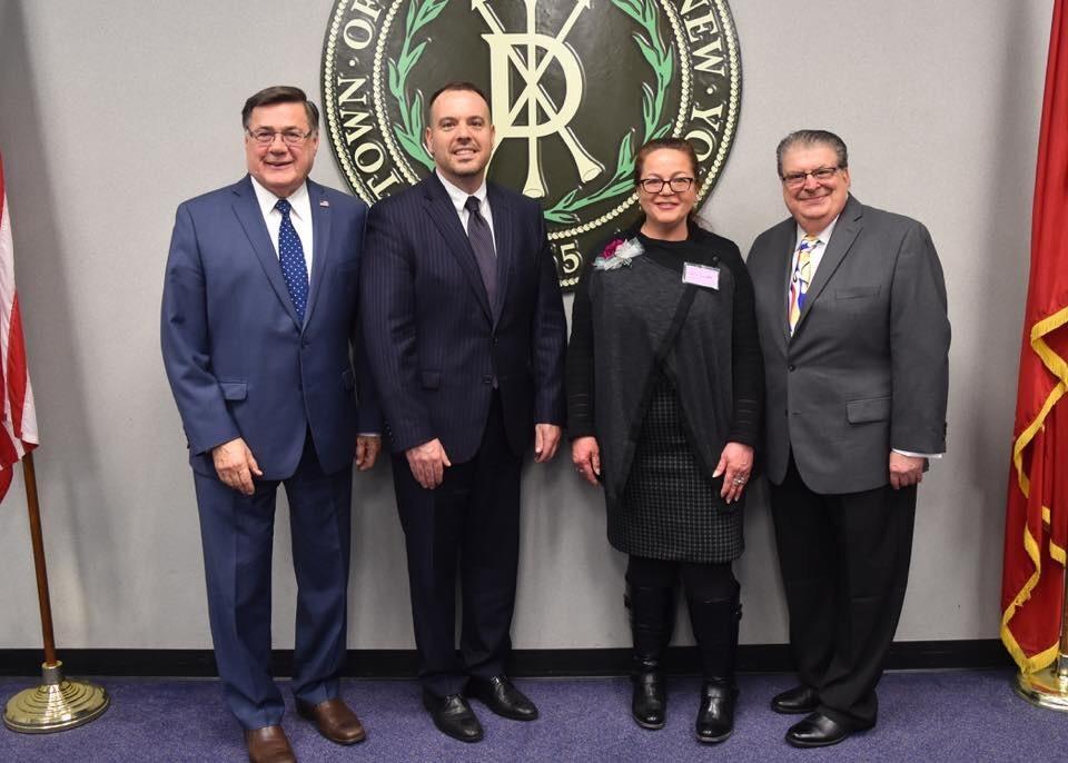 With Cathy Cutler, recipient of the 2019 Town of Brookhaven (TOB) Women in Science Award are, from left, Edward Romaine, TOB Supervisor; Dan Panico, Councilman (District 6); and Louis Marcoccia, TOB Receiver of Taxes. Cutler received the award for her scientific accomplishments in the field of radioisotopes. She was honored at a ceremony held at Brookhaven Town Hall on March 21.