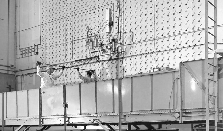 Workers load uranium slugs into the X-10 Graphite Reactor at Oak Ridge in 1943