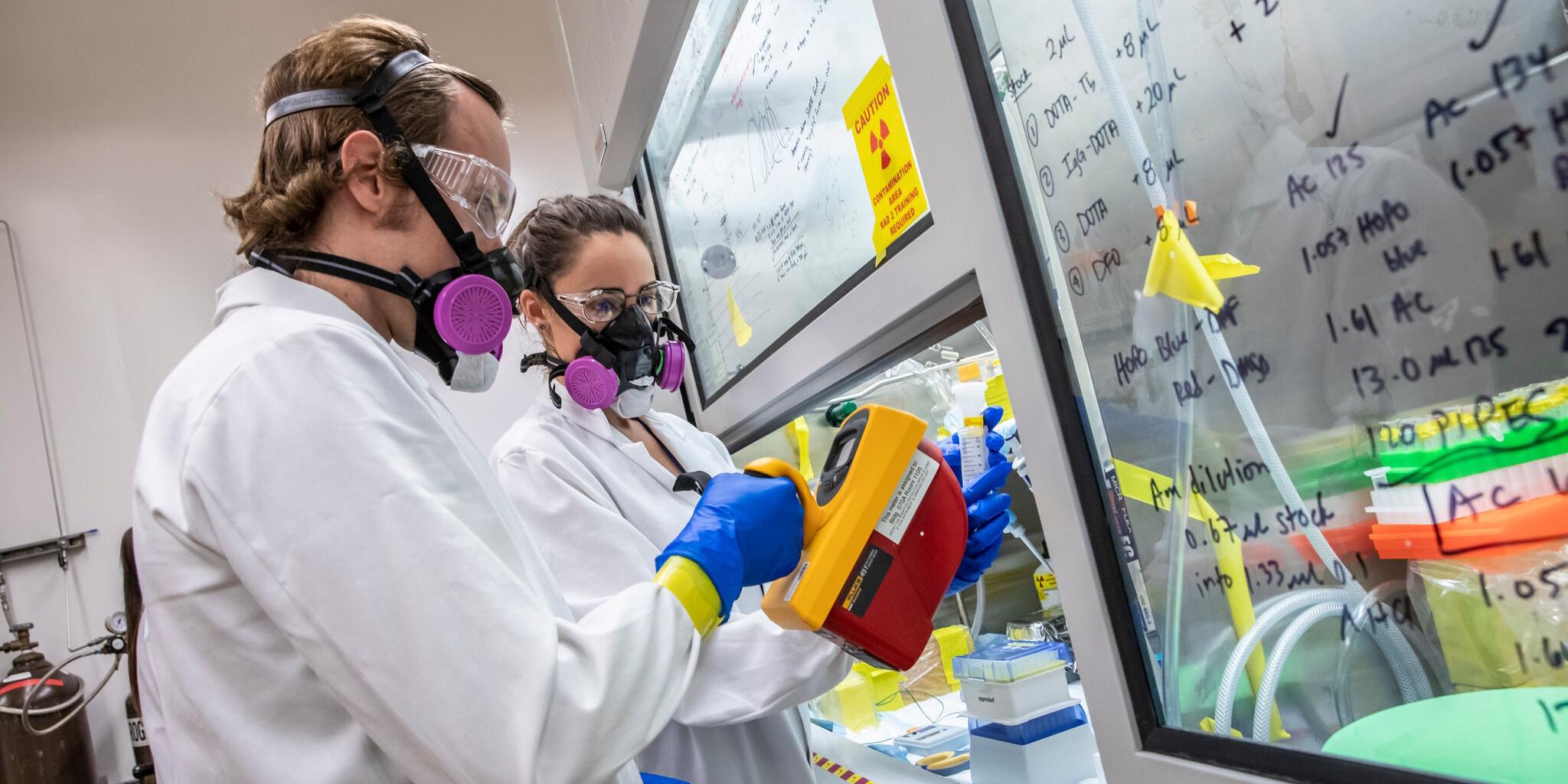 Scientists, like Korey Carter, left, and Katherine Shield, had to overcome what one of their collagues called “a long series of unfortunate events” to work out einsteinium’s chemical properties.Credit...Marilyn Sargent/Lawrence Berkeley National Laboratory, University of California